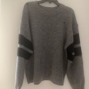 Distressed sweater small holes throughout as styled